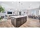 View of kitchen island and dining area from living room at 711 W Paso Nuevo Dr, Phoenix, AZ 85086