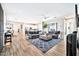 Open living room with wood floors flows into kitchen and dining areas at 711 W Paso Nuevo Dr, Phoenix, AZ 85086