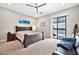 Main bedroom with sliding glass door and ceiling fan at 711 W Paso Nuevo Dr, Phoenix, AZ 85086