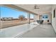 Inviting covered patio with ceiling fans, and a TV, overlooking a large backyard with plenty of room to roam at 711 W Paso Nuevo Dr, Phoenix, AZ 85086