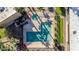 Aerial view of a community pool with mature trees and lounge chairs at 7110 E Continental Dr # 1031, Scottsdale, AZ 85257