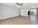 Open concept living room with tiled floors, a ceiling fan, and easy access to the kitchen at 7110 E Continental Dr # 1031, Scottsdale, AZ 85257