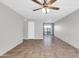 Cozy living room with tiled floors, a ceiling fan, and seamless access to the outdoor patio at 7110 E Continental Dr # 1031, Scottsdale, AZ 85257