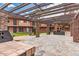 Outdoor patio area featuring stone columns and a built-in BBQ grill for social gatherings at 7110 E Continental Dr # 1031, Scottsdale, AZ 85257