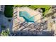 Aerial view of a sparkling community pool with surrounding patio and lounge area, perfect for relaxation at 7110 E Continental Dr # 1031, Scottsdale, AZ 85257