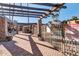 Community pool area featuring wrought iron gate and desert landscaping at 7110 E Continental Dr # 1031, Scottsdale, AZ 85257