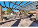 Community pool area featuring wrought iron gate and desert landscaping at 7110 E Continental Dr # 1031, Scottsdale, AZ 85257