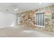 Expansive bedroom with neutral carpet and patterned accent wall with two windows at 739 E Glade Ave, Mesa, AZ 85204