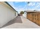 Long driveway with wood fence on one side at 739 E Glade Ave, Mesa, AZ 85204