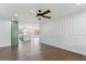 Bright living room with hardwood floors, ceiling fan, and decorative wall trim at 739 E Glade Ave, Mesa, AZ 85204