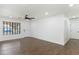 Bright living room with hardwood floors, a ceiling fan, and a doorway to another room at 739 E Glade Ave, Mesa, AZ 85204