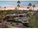 Expansive aerial view of a property featuring a pool, pergola, lush greenery, and stunning mountain views at 8008 N 66Th St, Paradise Valley, AZ 85253