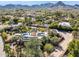 Expansive property featuring a pool and lush landscaping with views of the surrounding city and mountains at 8008 N 66Th St, Paradise Valley, AZ 85253