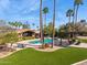 Gorgeous backyard oasis featuring a sparkling pool, pergola, lush landscaping and beautiful desert plants at 8008 N 66Th St, Paradise Valley, AZ 85253