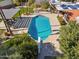 Aerial view of the pristine backyard pool, pergola, and lush landscape at 8008 N 66Th St, Paradise Valley, AZ 85253