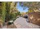 Inviting backyard area with a grill, dining table under an umbrella, and charming patio décor at 8008 N 66Th St, Paradise Valley, AZ 85253