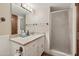 Bathroom featuring a granite-topped vanity, an undermount sink, and glass enclosed shower at 8008 N 66Th St, Paradise Valley, AZ 85253