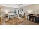 Cozy bedroom featuring a metal frame bed, ceiling fan, wood floors, and a unique rug adding charm at 8008 N 66Th St, Paradise Valley, AZ 85253