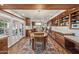 Bright dining area featuring wood cabinets and a full kitchen view at 8008 N 66Th St, Paradise Valley, AZ 85253