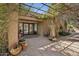 Stunning covered entry patio with potted plants and patterned tiles, leading to a grand entrance at 8008 N 66Th St, Paradise Valley, AZ 85253