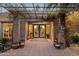 Inviting front entryway with beautiful tile work, potted plants, and a trellis at 8008 N 66Th St, Paradise Valley, AZ 85253