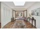 Bright foyer features a skylight, tile flooring, double door closet, and French doors to the outdoors at 8008 N 66Th St, Paradise Valley, AZ 85253