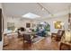 Cozy living room with brick fireplace, Saltillo tile flooring, and skylight at 8008 N 66Th St, Paradise Valley, AZ 85253