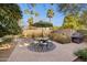 Outdoor dining area featuring a table with umbrella and a barbecue grill, perfect for entertaining at 8008 N 66Th St, Paradise Valley, AZ 85253