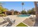 Pool area features stone deck, desert landscape, and comfortable lounge chairs at 8008 N 66Th St, Paradise Valley, AZ 85253