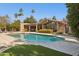 Beautiful pool with a lush green lawn and patio area, perfect for outdoor entertaining at 8008 N 66Th St, Paradise Valley, AZ 85253