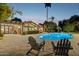 Inviting outdoor pool area with lounge chairs, a covered patio, and verdant landscaping perfect for entertaining at 8008 N 66Th St, Paradise Valley, AZ 85253