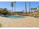 Lovely pool area with a covered patio, lounge chairs, and a desert landscaped yard at 8008 N 66Th St, Paradise Valley, AZ 85253