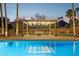 Sparkling pool with lit steps and shaded pergola, creating an ideal space for outdoor entertainment at 8008 N 66Th St, Paradise Valley, AZ 85253