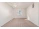 Bright bedroom featuring neutral carpeting, ceiling fan, and a window that provides natural light at 8588 E Indian School Rd # G, Scottsdale, AZ 85251