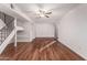 Spacious living room featuring wood-look floors and staircase at 8588 E Indian School Rd # G, Scottsdale, AZ 85251