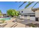 Relaxing pool area with barbecue grills, tables, and seating for outdoor enjoyment at 8588 E Indian School Rd # G, Scottsdale, AZ 85251