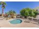 Inviting community pool with lounge chairs and lush landscaping for relaxation and enjoyment at 8588 E Indian School Rd # G, Scottsdale, AZ 85251