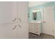 Bathroom with white vanity, framed mirror, and ample cabinet space at 8626 E San Miguel E Ave, Scottsdale, AZ 85250