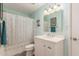 Bathroom with a white vanity, shower with curtain, and modern fixtures at 8626 E San Miguel E Ave, Scottsdale, AZ 85250