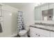 Bathroom featuring a tiled shower, marble counters, and a neutral color palette at 8626 E San Miguel E Ave, Scottsdale, AZ 85250