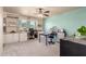 Bright craft room with ample storage, built-in shelving, and work spaces at 8626 E San Miguel E Ave, Scottsdale, AZ 85250