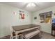 Cozy dining area with a large table, bench seating, and cheerful wall decor at 8626 E San Miguel E Ave, Scottsdale, AZ 85250