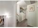 Bright hallway featuring wood-look flooring and staircase to the upper level at 8626 E San Miguel E Ave, Scottsdale, AZ 85250