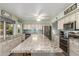 Bright kitchen featuring an oversized island, custom cabinets, and modern appliances at 8626 E San Miguel E Ave, Scottsdale, AZ 85250