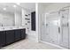 Bathroom showcasing dual sinks, soaking tub, and glass-enclosed shower for a luxurious spa experience at 864 W Blue Ridge Dr, San Tan Valley, AZ 85140