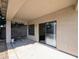 Covered back patio with a sliding glass door leading to the inside of the home at 8861 W Paradise Dr, Peoria, AZ 85345