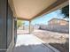 View of the backyard patio with a block fence and gravel landscaping at 8861 W Paradise Dr, Peoria, AZ 85345