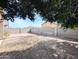 Wide shot of the backyard with a block fence and brick-covered patio at 8861 W Paradise Dr, Peoria, AZ 85345