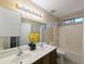 This is a bathroom with a double sink and a shower tub at 8861 W Paradise Dr, Peoria, AZ 85345