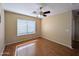 Bright bedroom with a ceiling fan and neutral color scheme at 8861 W Paradise Dr, Peoria, AZ 85345